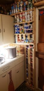 Build a Wall-Mounted Wooden Rack for Easy Canned Goods Rotation Image